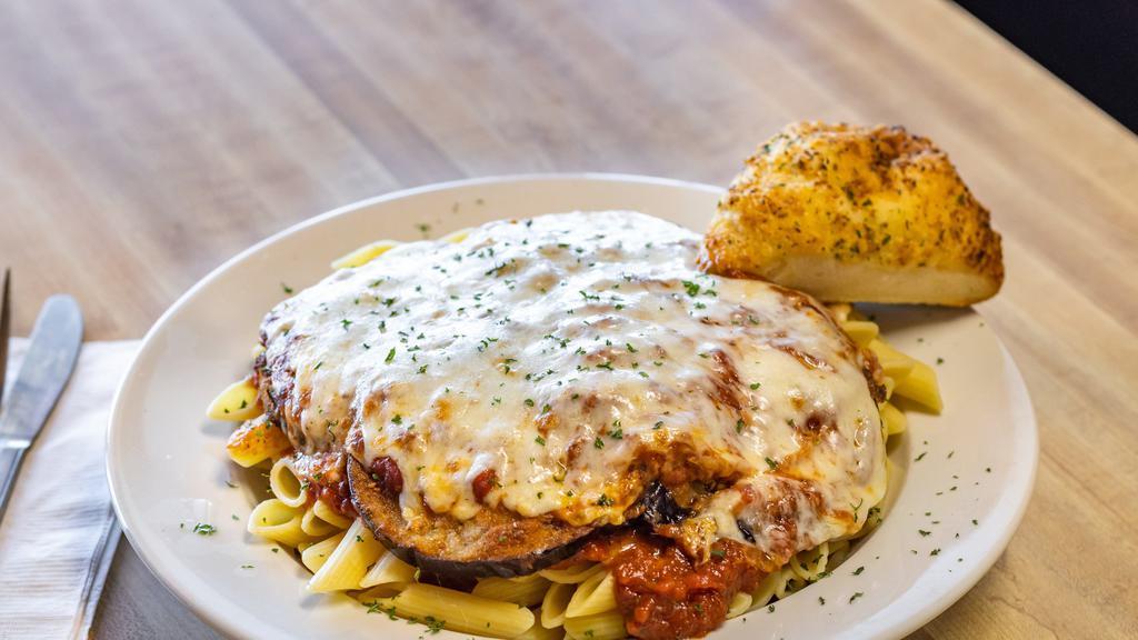 Eggplant Parmigiana · Freshly sliced and hand-breaded eggplant, lightly fried and topped with house-made marinara and mozzarella cheese.
