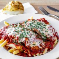 Veal Parmigiana · Hand breaded veal tenderloin topped with house-made marinara and melted mozzarella cheese. S...