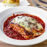 Rustic Lasagna · Layers of pasta, sauce, ground beef, sausage, ricotta and mozzarella cheese, cooked to perfe...