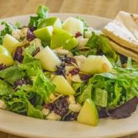 The Plum Tomato House Salad · Mixed greens with dried cranberries, toasted almonds, green apple and crumbled blue cheese. ...