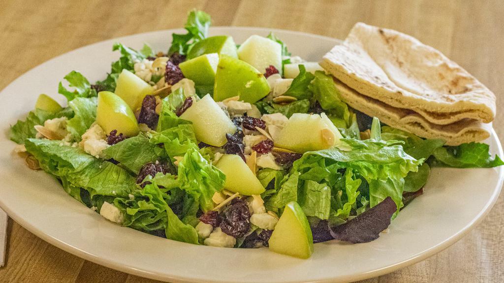 The Plum Tomato House Salad · Mixed greens with dried cranberries, toasted almonds, green apple and crumbled blue cheese. Raspberry vinaigrette dressing recommended. Served with pita bread.   Add  grilled chicken, chicken salad or tuna salad for an additional charge.