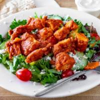 Buffalo Chicken Salad · Our garden salad with buffalo fried chicken and crumbled blue cheeses. Served with your choi...