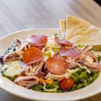 Antipasto Salad · Our garden salad with Genoa salami, ham, pepperoni, pepperoncini, shredded mozzarella and pr...