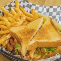 Turkey Club Plate · Sliced turkey, hickory smoked bacon, lettuce, tomato and mayo piled on grilled white or whea...