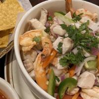 Ceviche Mixto · Fresh fish, shrimp, marinated in lemon-lime juice and spices.
