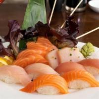 Sushi & Sashimi Combo · Five pieces of assorted sushi and twelve pieces of assorted sashimi (chef's choice) with a s...