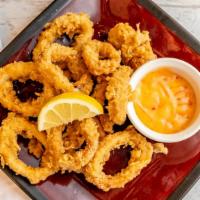 Calamares · Crispy deep fried battered squid rings served with our house sauce.