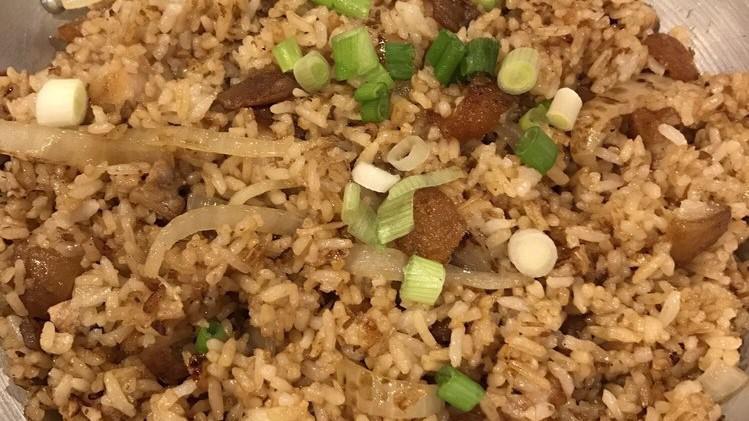 Bagoong Fried Rice · Fried rice mixed with bagoong (shrimp paste), chopped lechon kawali, topped with green onions.