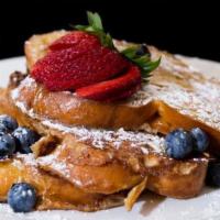 Challah French Toast   · Vanilla cinnamon challah french toast, fruit, and maple syrup.  (Vegetarian)