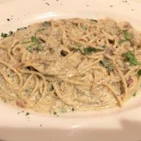 Spaghetti Carbonara · Sauteed bacon & onion in a creamy Alfredo sauce