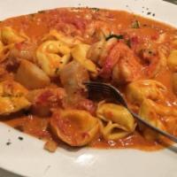 Tortelloni · Four cheese filled, sauteed with shrimp & scallops in a Vodka blush