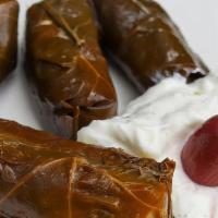 Dolmades · 6 pcs of the most famous Greek apetizer,served with tzatziki sauce.