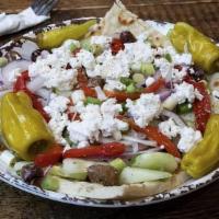 Village Salad · Tomatoes, cucumbers, red onions, sliced green onions, olives, feta cheese, red roasted peppe...