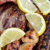 Mix Grill · Greek sausage,pork souvlaki,chicken souvlaki,beef & lamb kebab,pork belly,two sliced pitas,f...