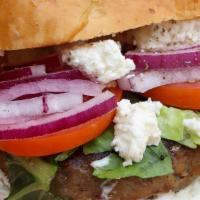 Greek Burger · Burger bun with tzatziki, tomatoes, onions, romaine, feta cheese and beef/lamb patty.