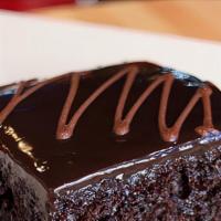 Greek Chocolate Pie · Juicy spong cake topped with chocolate fudge.