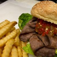 Roast Beef Sandwich · Slow cooked roast beef served on a toasted roll with your choice of cheese, lettuce, tomatoe...