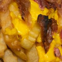 Bacon Cheese Fries · Fries with cheese, onions, and bacon. What's not to love?