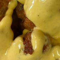 Honey Mustard Wings · Chicken wings breaded and fried, then tossed in honey mustard sauce.