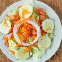 House Salad · Iceberg Lettuce, Tomato, Onion, Shredded Carrot, & Cucumber.