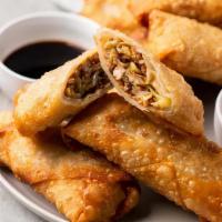 Spring Roll (Vegan) · Vegetable fritters, mildly spiced wrapped in thin flour wrappers deeply fried served with ta...
