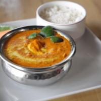 Chicken Tikka Masala · Marinated grilled chicken breast cooked in cashew based creamy sauce along with onion and to...