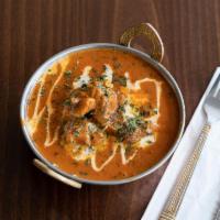 Butter Chicken · Marinated grilled chicken breast cooked in tomato based gravy, rich in butter with creamy ca...