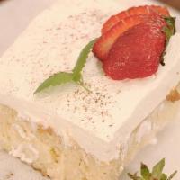 Tres Leche · A very light sponge cake soaked in three different kinds of milk. Topped with our homemade c...