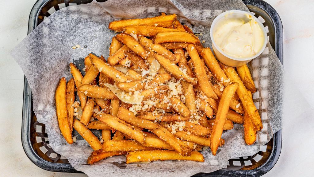 Parmesan French Fries · Parmesan dusted French fries and herbed truffled oil. Served with house aioli.