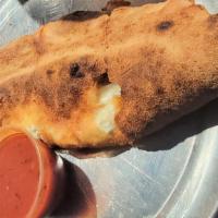 Chicken Parmesan Calzone · Served with ricotta and mozzarella, marina on side.