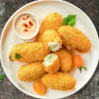 Holy Jalapeno Poppers · (Vegetarian) Fresh jalapenos coated in cream cheese and fried until golden brown.