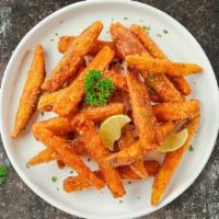 Sweet Potato Fries And Shine · (Vegetarian) Thick-cut sweet potato wedges fried until golden brown