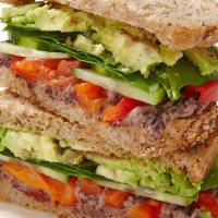 Veggie Sandwich · Vegetarian. Organic hummus, romaine, avocado, tomato, cucumber, red onion on your choice of ...
