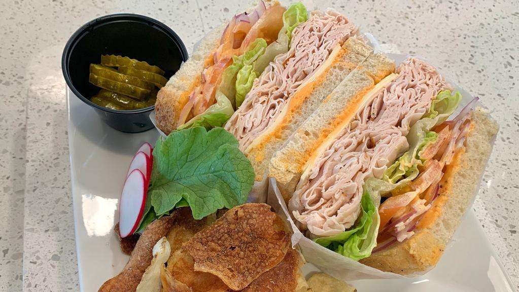 Hot Station Sandwich · Spicy. Turkey, American cheese, romaine, tomato, red onion, hot pepper, spicy mayo on your choice of bread. Comes with chips. Bread Choice; white, wheat, multigrain.