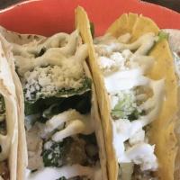 Meat Taco  (3) · 3 flour or corn soft or crispy tortillas 
topped with lettuce, queso fresco & sour cream.