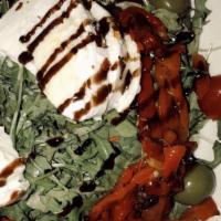 Burrata Salad · Burrata cheese on a bed of arugula, cherry tomatoes, black olives, oregano and extra virgin ...