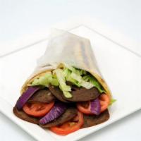 Lamb Gyro · Lamb gyro meat with gyro sauce served on our freshly baked bread with lettuce, tomatoes, and...