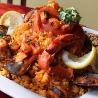 Paella Rincon · A mixture of seafood and rice /  una mezcla de mariscos y arroz.
