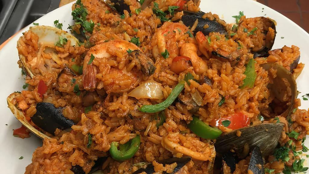 Paella Valenciana · A mixture of seafood, chicken, sausage and rice