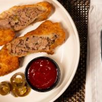 Cheesesteak Egg Roll · Served with spicy ketchup.