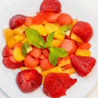 Fresh Fruit Salad · Gluten free. 8 oz. ripe melon with strawberries and kiwi.