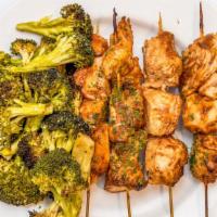 Bbq Chicken Kabobs With Broccoli · All natural chicken in BBQ sauce skewered and served with roasted vegetables.