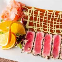Tuna Giallo · Black and white sesame seed crusted yellow fin tuna, served with a citrus micro greens salad...