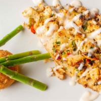 Crab Crusted Tilapia · Jumbo lump crabmeat crusted tilapia finished with a white wine chive-butter sauce.