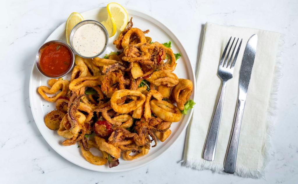 Fried Calamari · Crispy fried calamari tossed with hot cherry peppers served with Asiago and marinara dipping sauces.