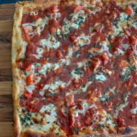 Margherita Pizza · White pizza with tomatoes, fresh mozzarella, Santucci sauce, and fresh basil leaves.