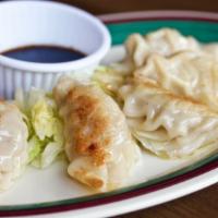 Gyoza · Pan­fried pork dumplings served with sweet soy sauce.