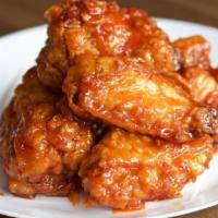 Hot Wings · Spicy. Deep-­fried saucy & crispy chicken wings in spicy sauce.