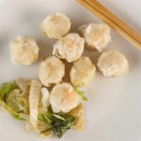 Shrimp Shumai · Steamed shrimp shumai served with sweet soy sauce.