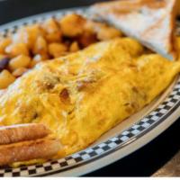 Meat Lovers Omelette · 3 eggs, bacon, ham, sausage and cheddar cheese.